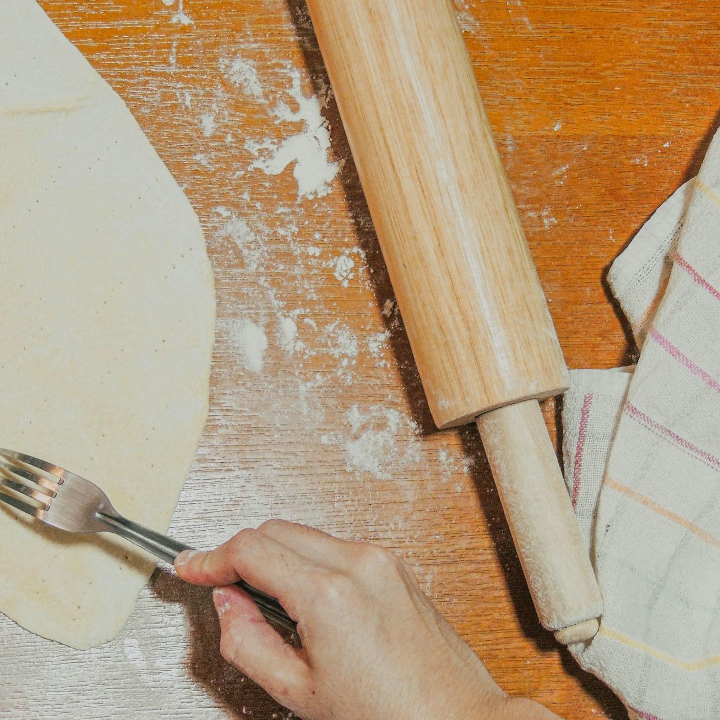 Community members collaborating in a modern kitchen space, sharing recipes and cooking techniques